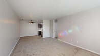 Located at 5179 Dempster Dr in Columbus, OH, this single-floor home offers four bedrooms and two bathrooms within a practical and well-organized layout. The open living room is generously sized, featuring neutral-toned carpet, a ceiling fan, and direct sightlines to the kitchen, creating a connected and functional common area. Natural light filters in through multiple windows dressed with blinds throughout the home.

The galley-style kitchen is a standout feature, showcasing rich dark espresso cabinetry, white quartz countertops, a black undermount sink with a matte black faucet, and black appliances including an electric range — all complemented by light wood-style flooring.

Each of the four bedrooms is carpeted and includes windows that bring in natural light. Several bedrooms are equipped with sliding closets featuring built-in hanging rods, providing practical storage. The primary bedroom offers a comfortable footprint and direct access to one of the bathrooms.

The bathrooms are cleanly finished with light wood-style flooring, white quartz vanity tops, modern gray cabinetry with sleek hardware, and minimalist black fixtures. The layout of the bathrooms is efficiently divided, with the vanity area separate from the toilet compartment. Hallways and closets round out the home's layout, maximizing storage and circulation throughout.