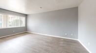 This 600 square foot single-story home in Albuquerque, NM, offers a well-designed living space with modern updates. The property features one bedroom and one bathroom, making it an ideal choice for singles or couples. The interior showcases a neutral color palette with light gray walls and warm wood-look flooring throughout, creating a cohesive and inviting atmosphere.

The kitchen is efficiently designed with white cabinetry, providing ample storage space. It includes essential appliances and a clean, bright aesthetic. The bedroom, measuring 170 square feet, is generously sized for the home's overall footprint. It boasts a large window allowing natural light to flood the space and includes a built-in vanity area and closet for added convenience.

The bathroom has been beautifully updated with marble-look tile surrounds, a modern vanity, and a full-size bathtub, offering a touch of luxury in this compact home. The living room provides a comfortable area for relaxation and entertainment, with plenty of wall space for furniture arrangement.

Throughout the home, ceiling fans aid in air circulation, while vertical blinds on the windows offer privacy and light control. The property also features updated heating and cooling systems for year-round comfort. This thoughtfully renovated home maximizes its square footage, creating a functional and attractive living space in a desirable Albuquerque location.