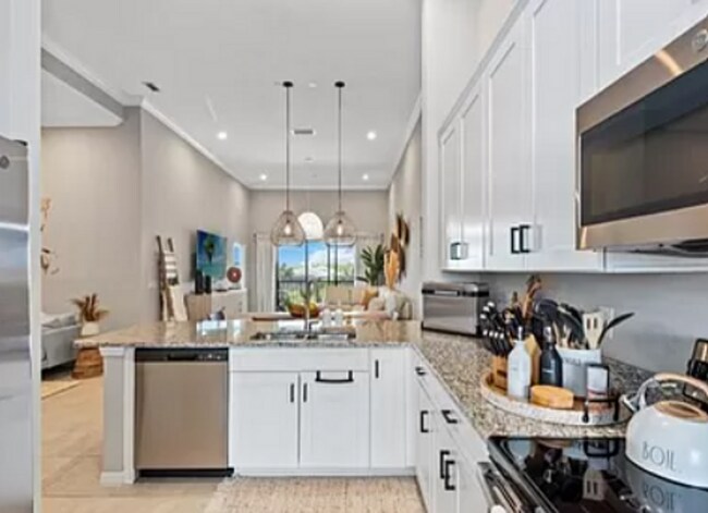 Building Photo - ** NEW CONSTRUCTION VERY MODERN 2 PLUS A DEN 2ND FLOOR CONDO WITH GOLF!!! ESPLANADE GOLF & COUNTR...