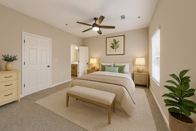 Cozy bedroom with ensuite bathroom. - Preston Hills at Mill Creek Apartments