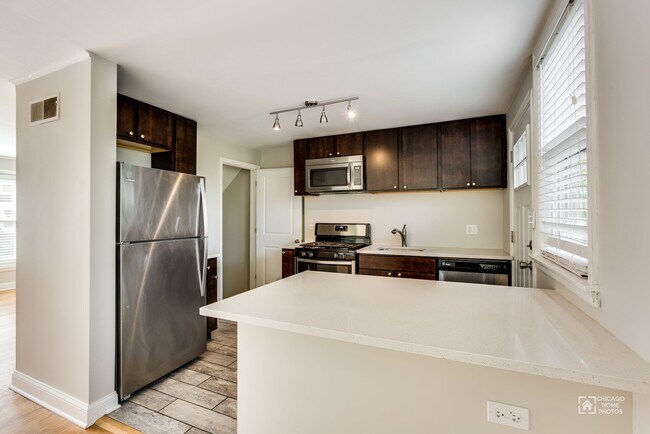 Updated Kitchen with Penisula - Carmen-Parkside Townhomes