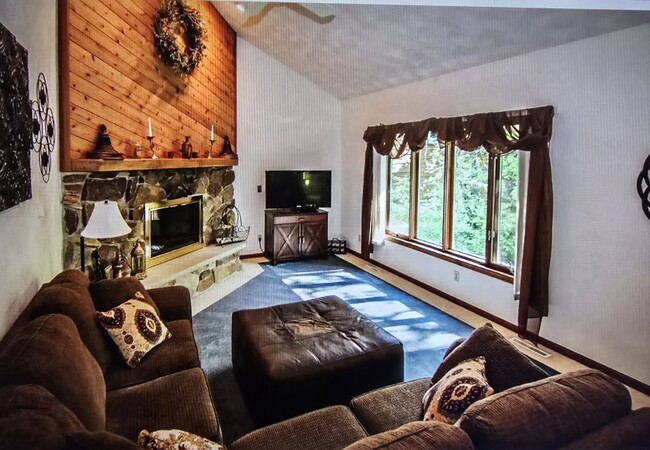 Open living room with big window for natural light and scenery - 808 Pony Ln