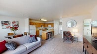 Located at 301 Friendship Ave in Hallam, Pennsylvania, this single-floor residence offers a thoughtfully designed open-concept layout that seamlessly connects the living, dining, and kitchen areas. The living room is finished with plush carpeting and features large windows that invite abundant natural light, creating a bright and welcoming atmosphere. A dedicated dining area sits adjacent to the living space, providing a comfortable area for meals and gatherings.

The kitchen is well-equipped with warm oak cabinetry, light countertops, and a full suite of white appliances including a gas range, microwave, dishwasher, and refrigerator. Stone-look tile flooring grounds the space, and a central island with bar seating adds both prep space and casual dining functionality.

The residence includes multiple bedrooms, each carpeted and featuring generous closet space with sliding or paneled doors. The bedrooms are bathed in natural light from large windows overlooking the surrounding neighborhood. 

Two bathrooms serve the unit, both finished with stone-look tile flooring. One bathroom features a pedestal sink with grab bars for added accessibility, while the second includes a wood-toned vanity with ample storage and a well-lit mirror. Together, these spaces offer a comfortable and functional single-level living experience.