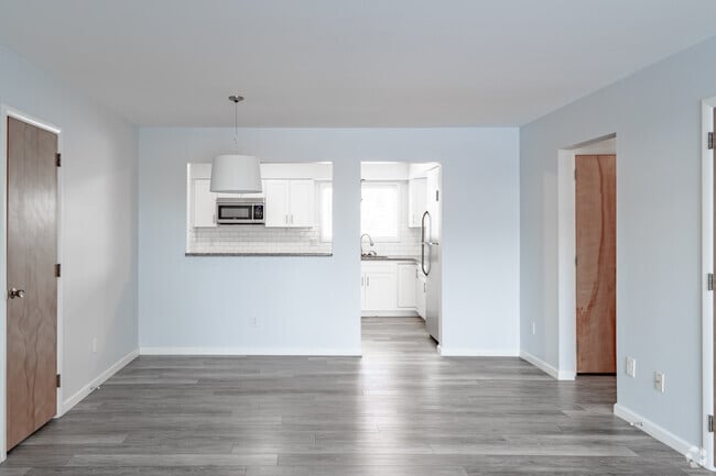 2BR, 2BA - 1,100SF - Living and Dining Area - Woodview Apartments