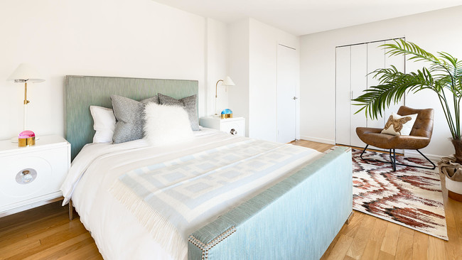 photo of 201 East 69th St Model Apartment PHS bedroom staged with modern furniture - The Fairfax