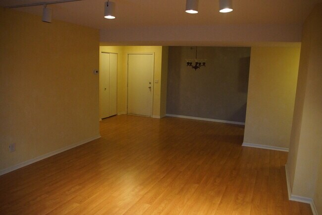 View of Dining area and front door from living room - 121 Washington Ave S