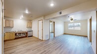 Located at 543 N Alexander in Ellsworth, Wisconsin, this 2-bedroom, 1-bathroom unit offers a practical and modern layout across a single floor. Light hardwood-style flooring and warm wood-trimmed doorways run throughout, creating a cohesive and clean aesthetic.

The open-concept kitchen and living area serves as the heart of the unit. The kitchen is well-equipped with light maple cabinetry, marble-style countertops, stainless steel appliances including a refrigerator, electric range, and dishwasher, plus a dedicated pantry for additional storage. Ceiling fans in the living and bedroom areas provide year-round comfort.

Both bedrooms are comfortably sized and feature natural light from windows with outdoor views, ceiling fans, and generous closet space with double bi-fold doors. The primary bedroom is spacious and includes its own closet. A total of three closets are distributed throughout the unit for ample storage.

The bathroom is designed with accessibility in mind, featuring grab bars near the toilet and shower area, and continuing the light flooring found throughout the home. A dedicated laundry area and in-unit storage add further convenience. The unit's clean, neutral palette and modern finishes make it a functional and inviting living space.