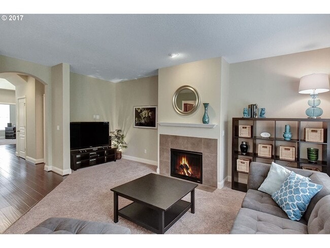 Building Photo - Bright and Open Floor Plan with Fireplace, Attached Garage & Vaulted Ceilings