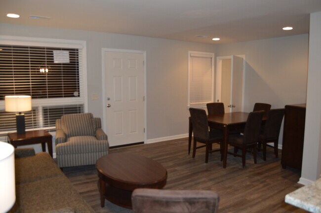 Living room opens to kitchen and stairs leading to downstairs - 828 Young's Lane