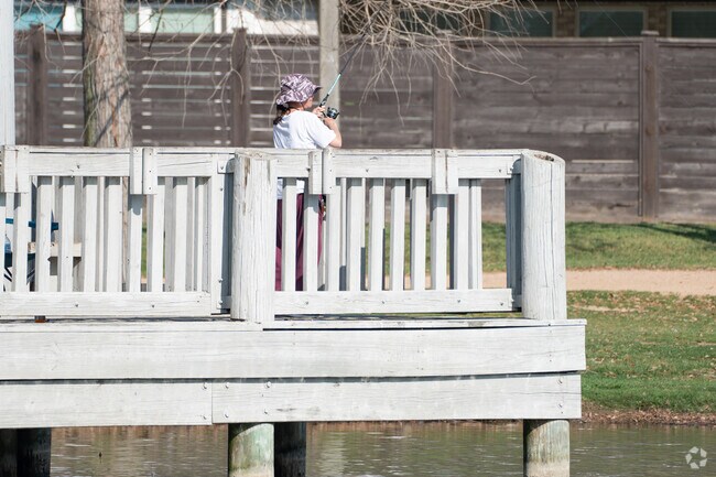 Visitors relish fishing at the park's stocked lake or exploring its serene walking trails.