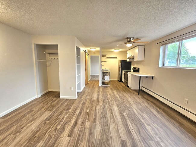 #102 LR onlooking Nook and Kitchen - 12th and Wads Residences
