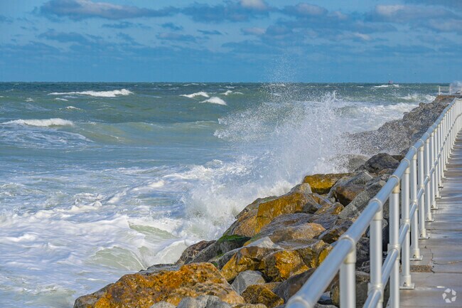 Watch the waves crash against the rocks from the walkway at Lighthouse Point Park.