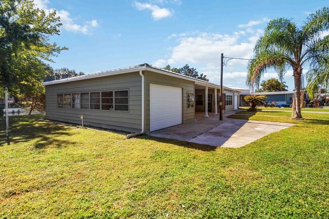 Building Photo - Charming 2BR/2BA Waterfront Home for Rent with Canal Access & Two Garages