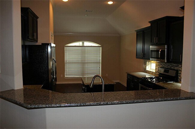 View of Kitchen from Family room - 3127 Sherbrooke Canyon Ln