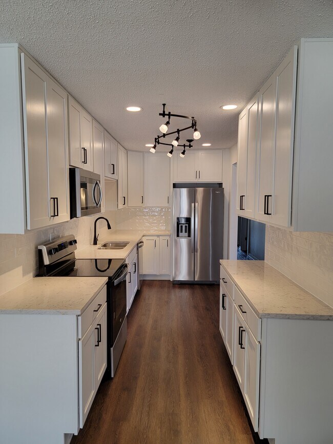 New open kitchen and appliances. - 6578 Poplar Woods Cir S