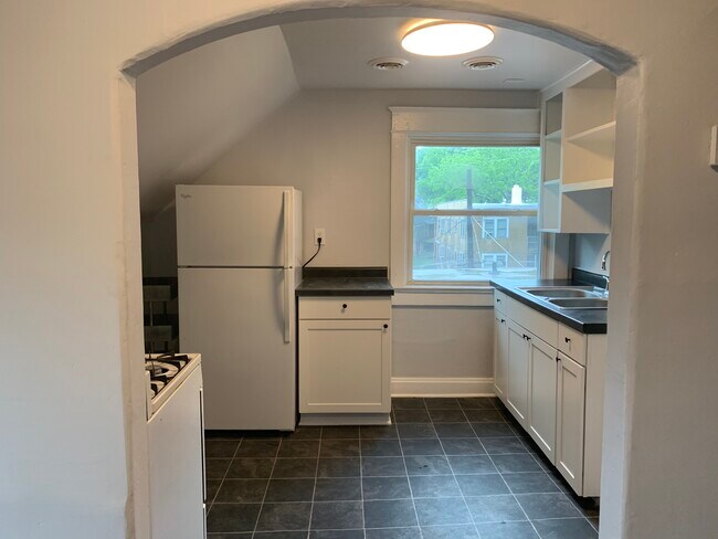 Kitchen with gas stove and fridge - 3916 Charlotte St