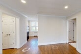 Located at 188 Bellevue Avenue in Montclair, NJ, this two-bedroom, one-bathroom residence offers a well-organized single-floor layout with classic architectural details throughout. Rich hardwood floors extend across the living areas, complemented by crisp crown molding and recessed lighting that lend a polished, timeless character to each room.

The living room is bright and open, with a large window that invites natural light and frames views of the surrounding greenery. A wall unit and radiator provide year-round climate control. The kitchen is functional and efficiently laid out, featuring hardwood floors and windows for natural light.

The primary bedroom is generously proportioned and includes two double closets with built-in shelving and hanging rods, offering exceptional storage. A large window provides natural light and outdoor views. The second bedroom is a comfortable size, featuring its own closet with built-in shelving and a window with natural light.

The bathroom is finished with light ceramic tile flooring, a tub-shower combination with a glass door, and a window for ventilation. Connecting the rooms, the hallways feature the same continuous hardwood flooring and crown molding, reinforcing the home's cohesive, well-maintained aesthetic throughout.