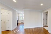 Located at 188 Bellevue Avenue in Montclair, NJ, this two-bedroom, one-bathroom residence offers a well-organized single-floor layout with classic architectural details throughout. Rich hardwood floors extend across the living areas, complemented by crisp crown molding and recessed lighting that lend a polished, timeless character to each room.

The living room is bright and open, with a large window that invites natural light and frames views of the surrounding greenery. A wall unit and radiator provide year-round climate control. The kitchen is functional and efficiently laid out, featuring hardwood floors and windows for natural light.

The primary bedroom is generously proportioned and includes two double closets with built-in shelving and hanging rods, offering exceptional storage. A large window provides natural light and outdoor views. The second bedroom is a comfortable size, featuring its own closet with built-in shelving and a window with natural light.

The bathroom is finished with light ceramic tile flooring, a tub-shower combination with a glass door, and a window for ventilation. Connecting the rooms, the hallways feature the same continuous hardwood flooring and crown molding, reinforcing the home's cohesive, well-maintained aesthetic throughout.