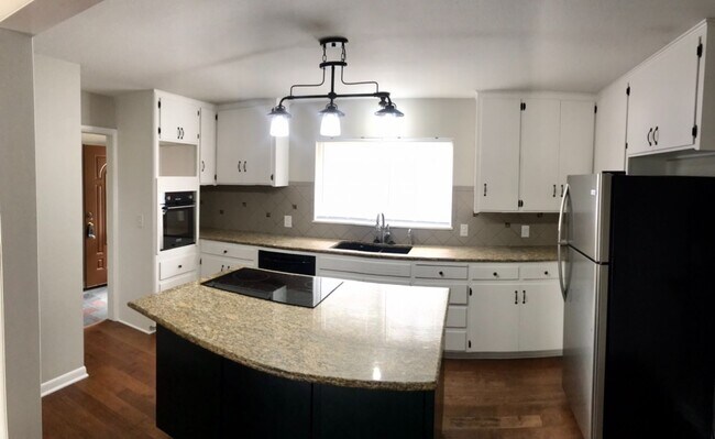 Building Photo - 4 bed / 1 bath 2 car garage home available...