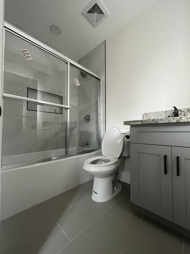 En suite bathroom with brand new tub shower - 6247 Agra St