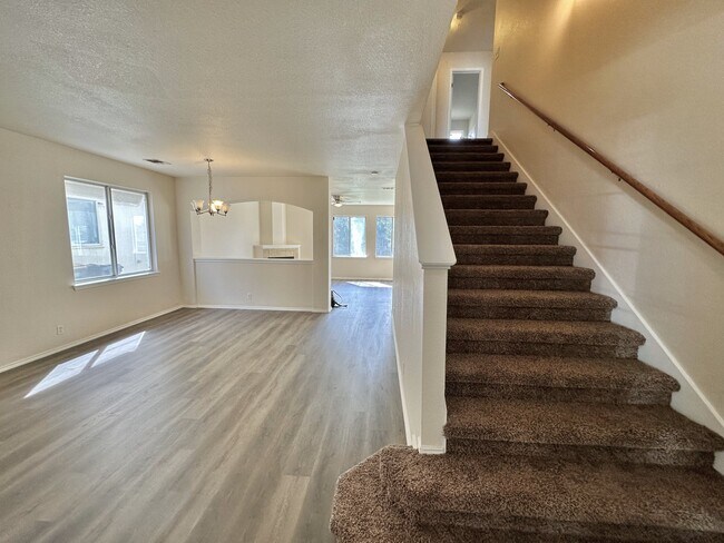 Entry to large living room and stairway - 13906 Randalstone Dr