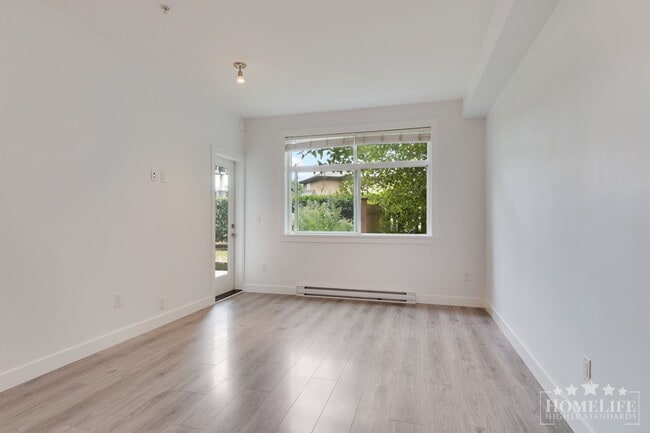 Building Photo - 2 - Bed + 2 - Bath + Den Ground Level Cond...