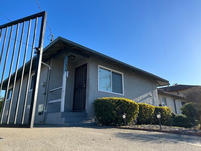 Front door and iron gate - 1656 150th Ave