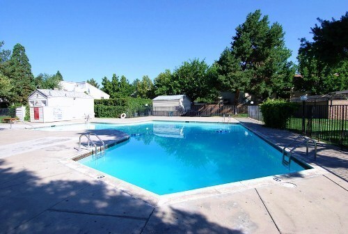Building Photo - ENJOY THE POOL THIS SUMMER IN THIS GATED C...