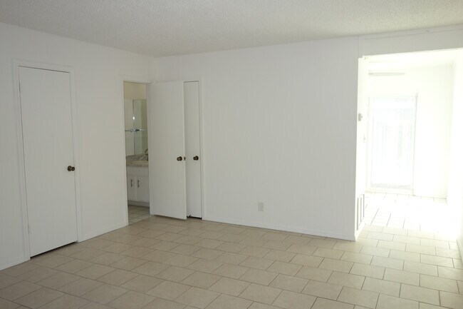 Living room, facing west, Half Bath door on left - 3451 E 35th St