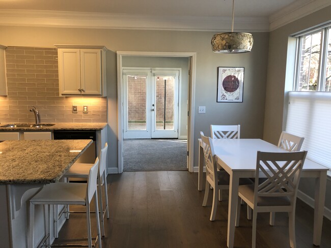 Kitchen table and island seating with convertible office opening to private patio - 2310 Elliott Ave