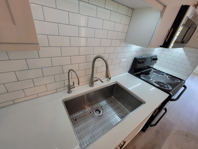 Kitchen with filtered water dispenser - 12655 Bluff Creek Dr