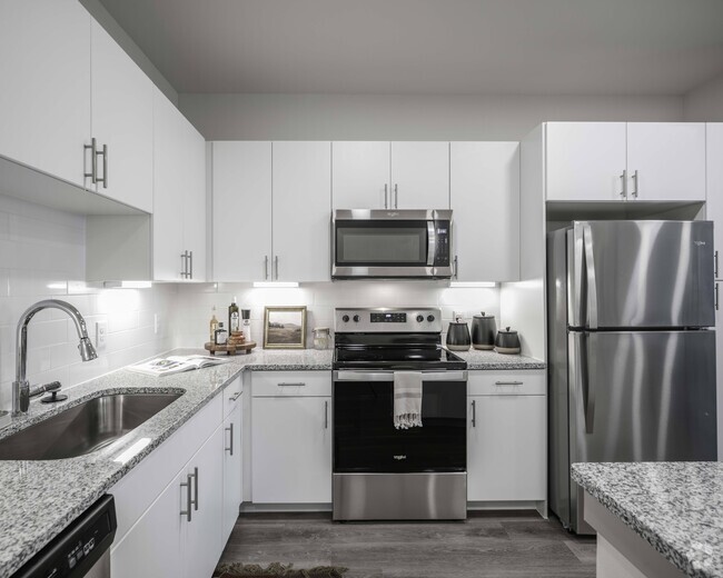 Gourmet kitchen with granite countertops - Beckett Cottingham