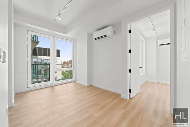 Building Photo - Bright 2BR with Terrace, Views & Exceptional Storage