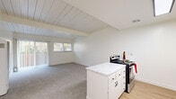 This 750 square foot single-story residence in Castro Valley offers a thoughtfully designed living space with two bedrooms and one bathroom. The home's interior is characterized by a bright, airy ambiance, enhanced by multiple windows that flood the rooms with natural light. The primary bedroom, measuring 160 square feet, provides a spacious retreat.

The kitchen showcases a contemporary design with white cabinetry, stainless steel appliances, and a practical layout. A peninsula counter offers additional workspace and casual dining options. The bathroom features a clean, modern aesthetic with a shower/tub combination and ample vanity space.

Throughout the home, neutral-toned carpeting in the bedrooms and living areas creates a cohesive look, while the kitchen and bathroom boast easy-to-maintain hard surface flooring. The living spaces are adorned with ceiling fans, adding both style and functionality.

Storage needs are addressed with two closets, ensuring ample space for personal belongings. The property's open floor plan, as seen in the 3D view, promotes a sense of spaciousness and flow between rooms. Located in the 94546 zip code, this home combines efficiency and comfort in a desirable Castro Valley setting.