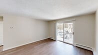 Located at 16 Bailey Ct in Canton, MA, this 2-bedroom, 1-bathroom residence offers a thoughtfully arranged single-floor layout that maximizes functionality and comfort. Hardwood-style flooring runs throughout, lending a clean, cohesive look across all rooms.

The living room is a bright, open space highlighted by a sliding glass door that opens to a private balcony with outdoor views — an ideal spot for natural light and fresh air. Baseboard heating is present throughout the home, ensuring consistent warmth. The textured ceiling in the living area adds a subtle architectural detail.

The kitchen is well-appointed with white shaker-style cabinetry, light countertops, and a full suite of stainless steel appliances, including a range, microwave, dishwasher, and refrigerator. Light wood-tone flooring ties the kitchen seamlessly into the rest of the home.

Both bedrooms are generously proportioned, with the primary bedroom offering a spacious footprint, a double sliding-door closet, and ample natural light from multiple windows. The second bedroom also features a closet and connects conveniently to the hallway. A dedicated hallway provides practical flow between all rooms, completing this efficient and well-maintained residence in Canton, MA.