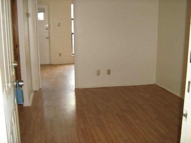 Living room, and entry to bedroom. - 4401 Speedway