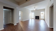 Located in Atlanta, GA, this single-floor residence offers a well-designed layout with a thoughtful blend of comfort and functionality. The open living area is a standout feature, showcasing warm hardwood-style flooring, a ceiling fan, and a classic fireplace framed by large windows that flood the space with natural light. An elegant arched doorway connects the living area to adjacent spaces, adding architectural character throughout.

The kitchen is both stylish and practical, featuring white shaker cabinetry, granite countertops, a tile backsplash, stainless steel appliances including a dishwasher and range, and hardwood-style flooring that ties seamlessly into the main living areas. Track lighting adds a modern touch to the galley-style layout.

The bedrooms are carpeted for comfort, each offering generous proportions, neutral tones, and ample natural light through large windows. Closet access is conveniently located within the bedrooms.

The bathrooms are finished with white cabinetry, granite vanity countertops, tub and shower combinations with tile surrounds, and hardwood-style flooring. One bathroom features a distinctive porthole window, adding a unique design element. The overall palette of neutral tones and consistent finishes lends the space a clean, cohesive aesthetic throughout.