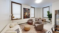 This 610 square foot apartment in Fort Wayne, Indiana, offers a thoughtful blend of comfort and functionality. The single-floor layout comprises one bedroom, one bathroom, and an open-concept kitchen and living area. The primary bedroom, measuring 170 square feet, features large windows with blinds, providing ample natural light and privacy.

The bathroom boasts a modern design with marble-look tiled walls, a combination tub and shower, and crisp white fixtures. The kitchen is efficiently designed with white cabinetry, stainless steel appliances, and a peninsula with seating for casual dining. The living area is versatile, accommodating both dining and lounging spaces with stylish, contemporary furnishings.

Throughout the apartment, a neutral color palette dominates, creating a bright and airy atmosphere. The space is enhanced by recessed lighting, air conditioning, and carefully chosen artwork. Wood-look flooring in the living areas and plush carpeting in the bedroom add warmth and texture.

Despite its compact size, the apartment doesn't compromise on storage, featuring built-in closets and additional cabinetry. The thoughtful layout and design elements make this Fort Wayne apartment an ideal space for comfortable, modern living.
