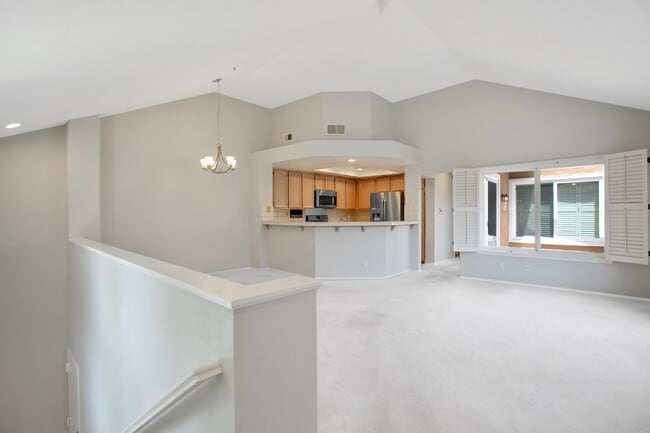 stairs, livingroom and kitchen - 24241 Swiftriver Ct