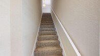 Located at 4159 Kenvil Dr in North Port, Florida, this well-appointed 2-bedroom, 2-bathroom home offers a comfortable and functional layout across a single floor. Light wood-style flooring flows throughout the space, complementing the warm, neutral-toned walls that create a bright and welcoming ambiance.

The open living area is highlighted by a ceiling fan, multiple windows, and a sliding glass door that invites natural light and provides access to an outdoor balcony with views of the surrounding greenery. The adjacent kitchen is equipped with stainless steel appliances — including a refrigerator, range, and built-in microwave — paired with rich wood cabinetry and granite countertops. A dedicated dining area sits nearby, completing the open-concept common space.

Both bedrooms feature light flooring, large windows with exterior views, and generous closet access. The primary bedroom offers a comfortable footprint with a dedicated closet. The two bathrooms are finished with granite-topped vanities, warm wood cabinetry, and light flooring — one featuring a glass-enclosed tub/shower combo. Additional conveniences include a laundry area and carpeted stairwell access. Clean lines and consistent finishes give the entire home a cohesive, move-in ready feel.
