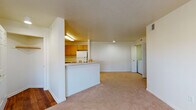 Located at 241 McMillan Ct in Cortland, Illinois, this single-floor residence offers a practical and well-organized layout designed for comfortable everyday living. The open-concept living and dining area is finished with plush wall-to-wall carpeting and neutral white walls, creating a bright and versatile space. A large window allows natural light to fill the room, enhancing its welcoming atmosphere.

The kitchen features warm wood-toned cabinetry with ample upper and lower storage, white countertops, and a gas range with overhead ventilation. A peninsula with a built-in sink connects the kitchen to the living area, providing a convenient breakfast bar and extra prep space. Hardwood flooring anchors the kitchen and entry areas, offering a durable contrast to the carpeted living spaces.

In-unit washer and dryer hookups are conveniently accessible from the main living area. The bedrooms are carpeted and generously sized, each equipped with closets featuring built-in hanging rods for organized storage. The bathrooms include one with a shower/tub combination and rich hardwood flooring, and another with a walk-in tiled shower stall. Throughout the residence, the clean, neutral palette and functional design provide a solid foundation for personalization.