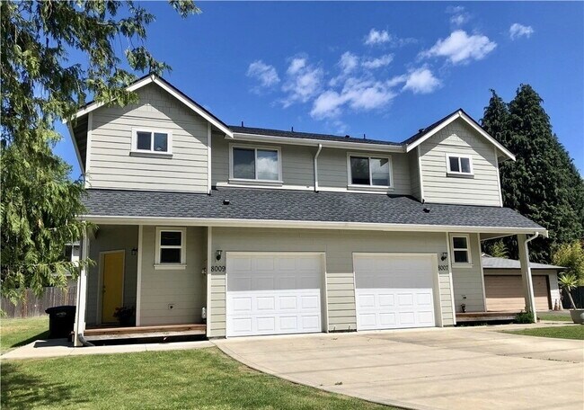 Building Photo - Updated University Place Townhome: 3 Beds, 2 Baths, Garage + Driveway Parking