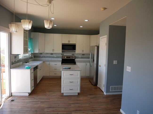 Building Photo - 4 Bedroom With AC with Solar Panels!