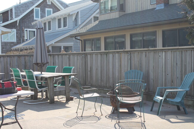 Fully fenced in yard with firepit, grill, dining and outdoor shower - 266 Cosey Beach Ave