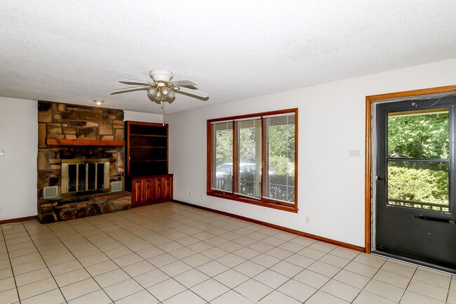 Building Photo - Two Bedroom, 2 Bath, 1-Car Garage, 1179 sq ft feet home with wood burning fireplace. and screened...