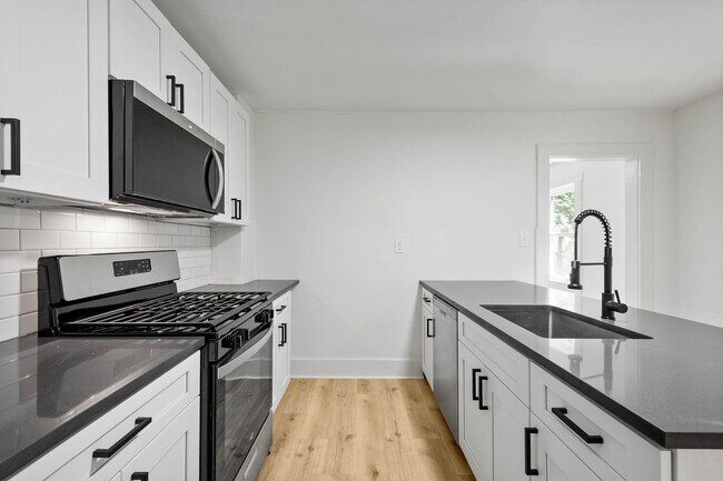 Building Photo - READY FOR MOVE IN! NEW RENOVATIONS in this...