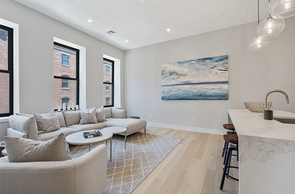 Open Living Room Floor Plan: High ceilings and expansive windows with natural light. - 355 Congress St