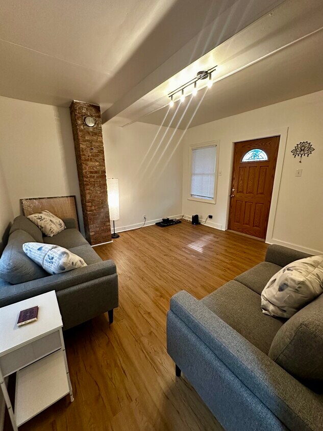 living room with brand new flooring and fresh paint - 264 Hamilton St