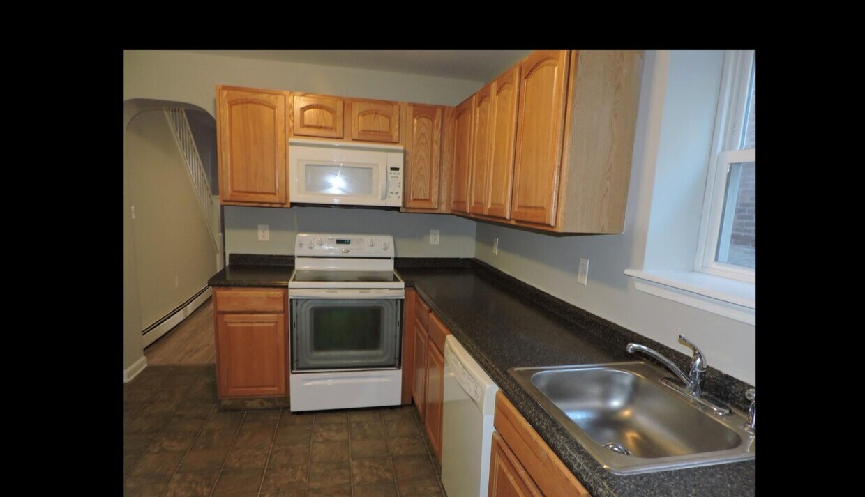 Kitchen - induction stove and microwave - 342 E Marshall St