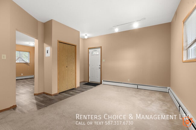 Building Photo - MAIN FLOOR UNIT With Assigned Parking